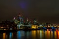 Waterside view of illuminated London cityscape at night - sightseeing United Kingdom