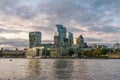 Waterside view of modern buildings in London under the cloudy sky Royalty Free Stock Photo