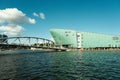 Waterside view of the NEMO science museum building under the blue sky in Amsterdam