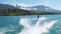 Waterskiing on sea or lake, water ski summer beach activity on vacations.
