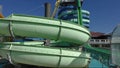 Waterslide of green colour in an aquapark