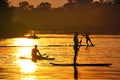 Watersports athlets at sunset wakeboarding and SUP Royalty Free Stock Photo