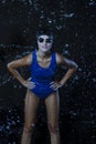 Watersports Concepts. Sensual Sportive Caucasian Female Swimmer in Swimsuit Posing in Goggles in Aqua Studio With Multiple Water Royalty Free Stock Photo