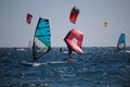 Watersports windsurfing, wingfoiling and kiteboarding at the sea