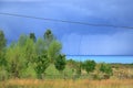 Waterspout (tornado) over the Issyk-Kul Lake in Kyrgyzstan. huge column between cloud and body of water