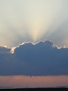 Waterspout, Twister, Tornado is Forming Over the Ocean and Sunrays are Beaming Over the Top of Clouds