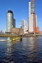 A watertaxi passing on an unusual warm Saturday in February at the Head of South in Rotterdam Royalty Free Stock Photo