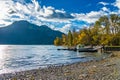 Waterton Middle Lake boat launch in autumn foliage season sunny day morning. Royalty Free Stock Photo