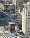 Watertower place surrounded by skyscrapers