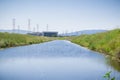 Waterway in San Francisco bay, NASA Ames Research Center in the background, Mountain View, California Royalty Free Stock Photo