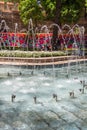 Waterworks fountain with water sprays and geysers in park or garden