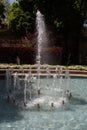 Waterworks fountain with water sprays and geysers in park or garden