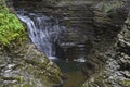 Cascading waters fill the rock made basin at the bottom of the gorge at Watkins Glen, NY State Park