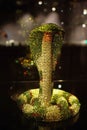 Swarovski Crystal Worlds museum, A figure of a green cobra snake on a shop shelf