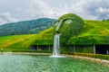 WATTENS, AUSTRIA, JULY 27, 2016: Fountain with giant head spitting water into a pond at swarovski Kristallwelten in
