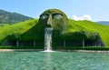 Swarowski Kristallwelten fountain in Wattens, with giant head spewing water into a pond Royalty Free Stock Photo