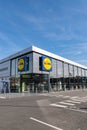 View of modern Lidl supermarket and logo.
