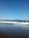 watu ulo beach and mountains in Jember regency, Java Royalty Free Stock Photo