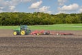 John Deere 8R 310 tractor pulling a Terradisc 6000 cultivator