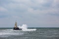 Wave board surfers and lighthouse Royalty Free Stock Photo