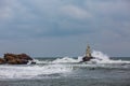 Wave board surfers and lighthouse Royalty Free Stock Photo