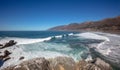 Wave breaking into cove at original Ragged Point peninsula at Big Sur on the Central Coast of California United States Royalty Free Stock Photo