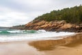 Wave breaking near the rocks on Sand Beach in Acadia National Park Royalty Free Stock Photo