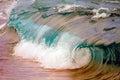 Wave breaking on shoreline.