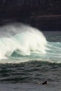 Wave breaking with a surfer Royalty Free Stock Photo