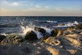 Sea spray on the rocks of the shore in the evening light of the sunset. 4 Royalty Free Stock Photo