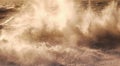 A wave breaks in a rough stormy sea sending white spray high into the air, motion and blur Royalty Free Stock Photo