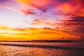 Wave at bright sunset or sunrise in ocean. Ocean with warm sunset colors in Bali Royalty Free Stock Photo