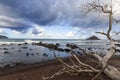 A wave crashes into the rocky shoreline of Hawaii