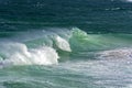 Wave crashing against rocks on the beach Royalty Free Stock Photo