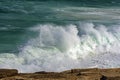 Wave crashing against rocks on the beach Royalty Free Stock Photo