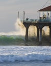 Wave Crashing into Manhattan Beach Pier Royalty Free Stock Photo