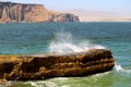 The Wave Crashing the Rock in the Pacific Ocean, Paracas National Reserve, Ica Region of Peru Royalty Free Stock Photo