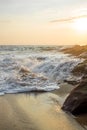 Wave crashing into rock at sunset on the beach in Mazunte Oaxaca Mexico Royalty Free Stock Photo