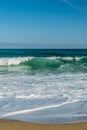 Layers of waves rolls onto sandy beach Royalty Free Stock Photo