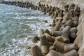 Wave dissipating tetrapod sea defenses along the coastline Royalty Free Stock Photo