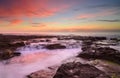 Wave flows over weathered rocks and boulders Royalty Free Stock Photo