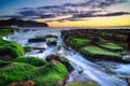 The wave flows over weathered rocks and boulders at Turimetta Be Royalty Free Stock Photo