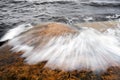 Wave hat on rock Royalty Free Stock Photo