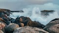 Wave hiting rocks at sunset