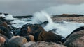 Wave hiting rocks at sunset