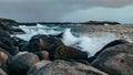 Wave hiting rocks at sunset Royalty Free Stock Photo
