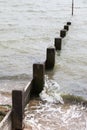 Wave hitting beach Groyne Royalty Free Stock Photo