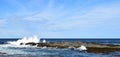 wave hitting a rock in the ocean making a big splash Royalty Free Stock Photo