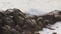 Wave hitting a waterblock in Italy - Riomaggiore