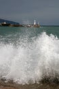 Wave and lighthouse Royalty Free Stock Photo